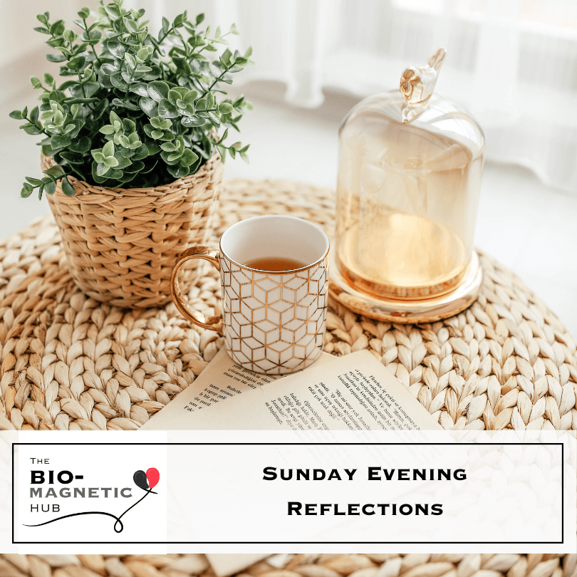 A cozy Sunday evening setup with a cup of tea, an open book, and a potted plant on a woven table, symbolizing relaxation and reflection.